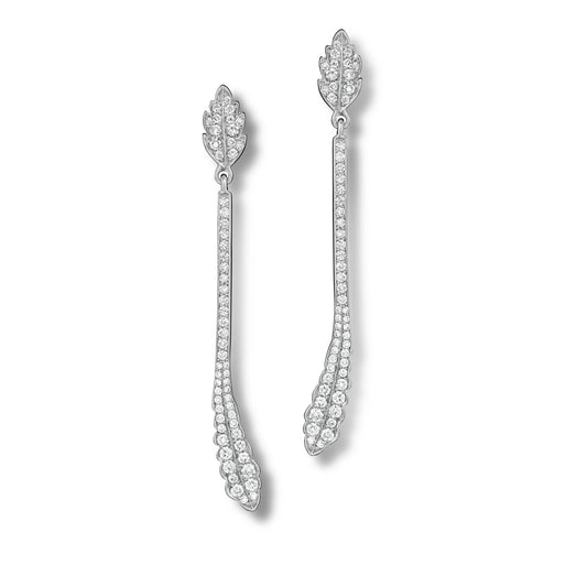 Pair of white gold earrings with intricate designs on a white background