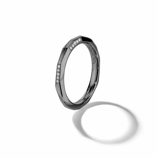 Black gold ring with small stones on a white background