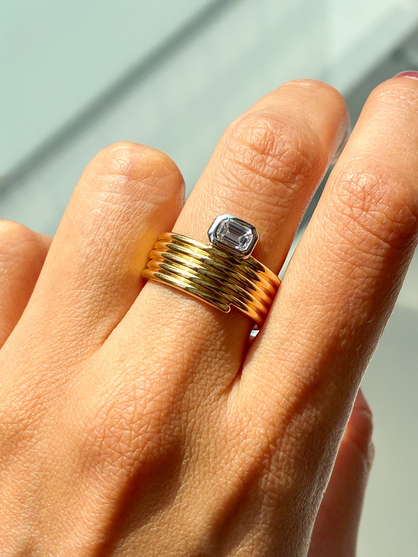 East/West Emerald Cut Diamond Bezel Ring